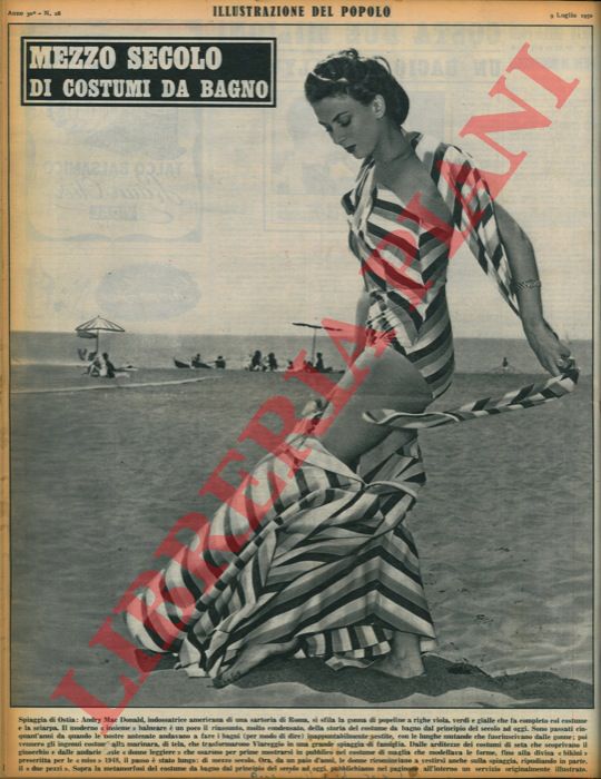 - - Mezzo secolo di costumi da bagno. Spiaggia di Ostia: Andry Mac Donald, indossatrice americana di una sartoria di Roma, si sfila la gonna di popeline a righe viola, verdi e gialle che fa completo col costume e la sciarpa.